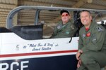 Jared Stadler,Cole High School student, sits in the cockpit of a T-6 Texan II while Maj. Todd Salzweder, 560th Flying Training Squadron director of staff, explains the aircraft controls July 17, 2015, during a Pilot for a Day event at Joint Base San Antonio-Randolph. Since 1994, squadron members have sponsored the “Pilot for A Day” program for children of all ages with chronic illnesses.   The goal of the program is to give these children a break from the challenges they face each day because of their illnesses. (U.S. Air Force photo by Melissa Peterson/Released)