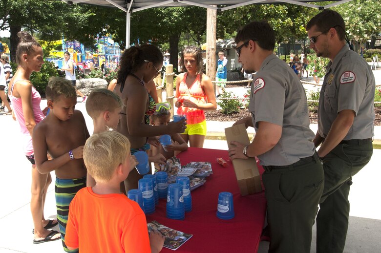 J. Percy Priest Lake Park Rangers hand out water safety information at Nashville Shores Lakeside Resort July 10, 2015.  The Corps is setting up a booth every Friday from noon to 2 p.m. to pass out water safety goodies and to talk with families about wearing life jackets when recreating at the park and lake.