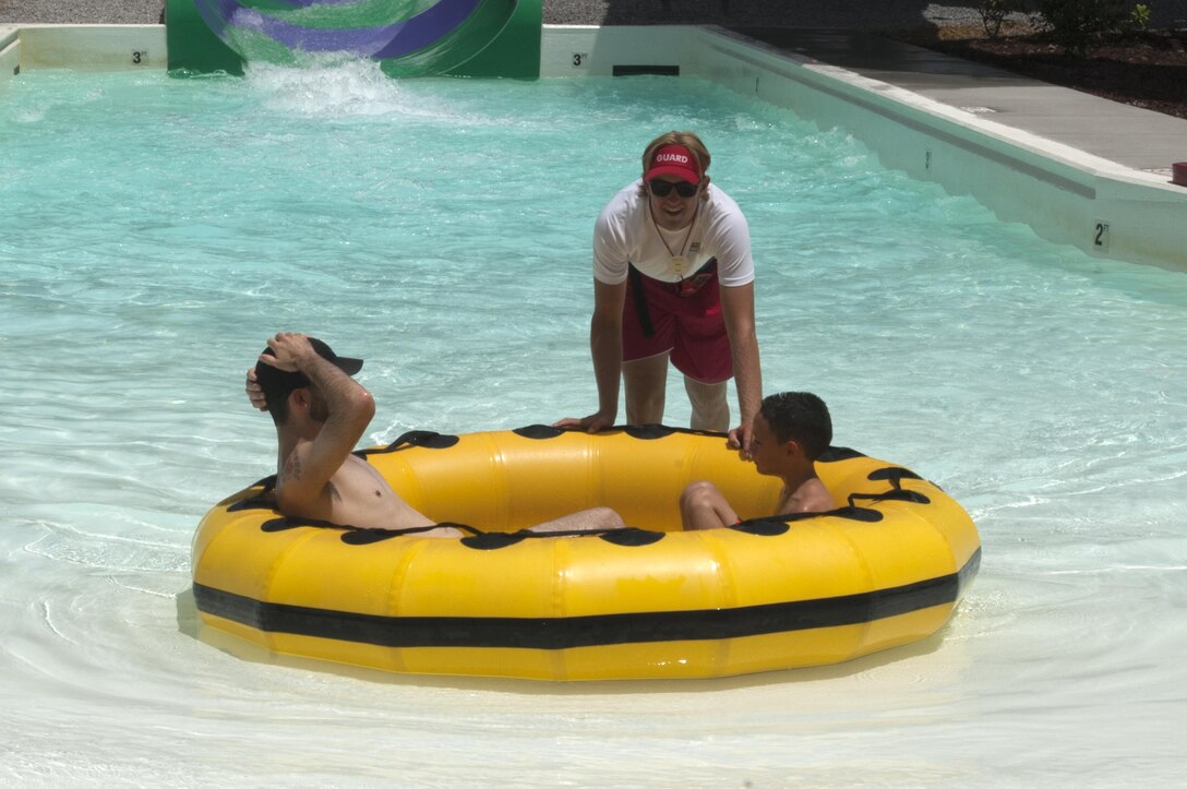 A life guard at Nashville Shores Lakeside Resort assists people exiting a ride at the park July 10, 2015.  The U.S. Army Corps of Engineers Nashville District’s park rangers at J. Percy Priest Lake are partnering with Nashville Shores Lakeside Resort this summer to promote water safety.  The Corps is setting up a booth every Friday from noon to 2 p.m. to pass out water safety goodies and to talk with families about wearing life jackets when recreating at the park and lake.