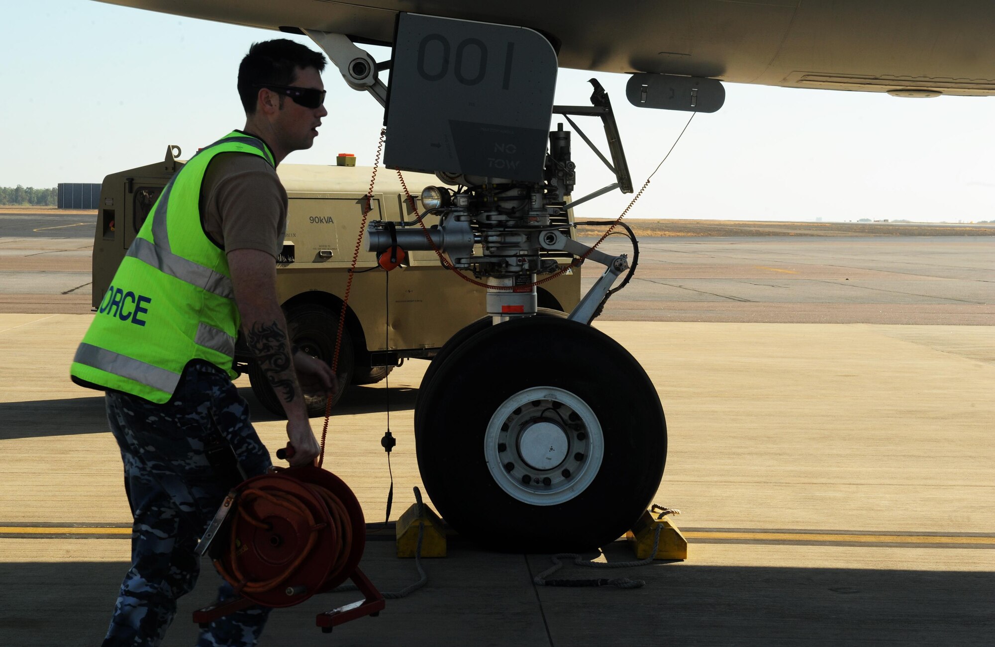 Royal Australian Air Force Leading Aircraftman Nick Hodkinson, an avionics technician with the No. 33 Squadron, prepares a KC-30A refueler for takeoff July 13, 2015 at RAAF Darwin, Australia. U.S. and Australian forces are conducting air refueling missions throughout the Talisman Sabre 2015 exercise to improve interoperability and familiarization with each other's procedures. Talisman Sabre is a biennial exercise that provides an invaluable opportunity for nearly 30,000 U.S. and Australian defense forces to conduct operations in a combined, joint and interagency environment that will increase both countries’ ability to plan and execute a full range of operations from combat missions to humanitarian assistance efforts. (U.S. Air Force photo by Staff Sgt. Alexander Martinez/Released)