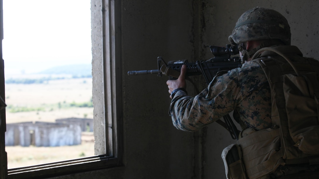 U.S. Marine Corps Sgt. Tyler Drew provides over watch of a cordon and search operation during the final exercise of Platinum Lion 15-3. The two-week training exercise is designed to strengthen the partnership between NATO nations and share knowledge to improve military skill sets. The culminating final event consisted of cordon and search operations, intelligence gathering and live-fire maneuver training. Drew is a squad leader with Golf Company, 2nd Battalion, 8th Marine Regiment, Black Sea Rotational Force.