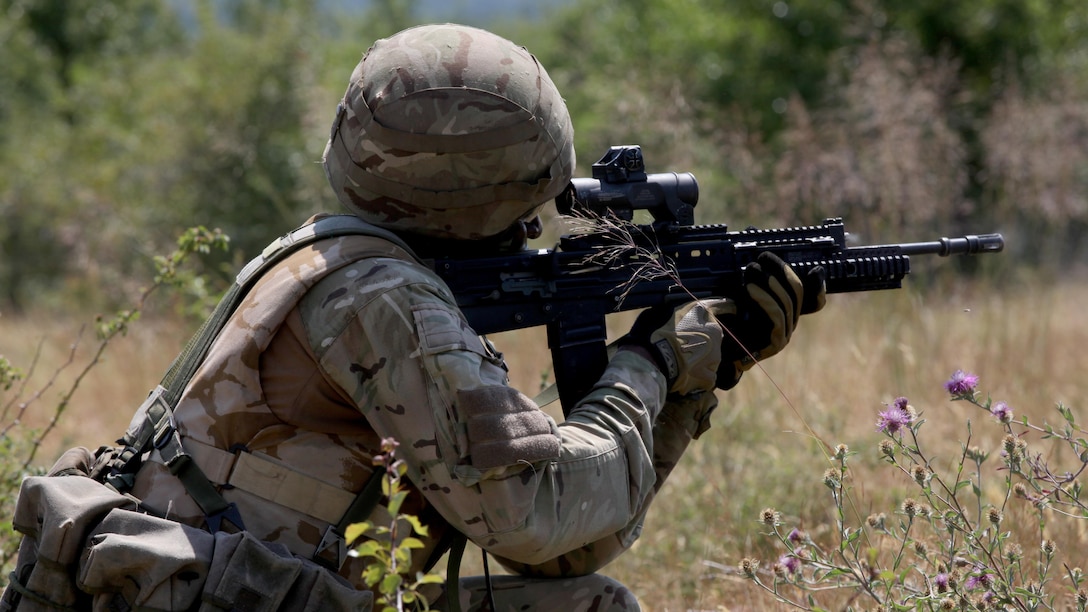A United Kingdom Royal Marine commando fires across the platoon live-fire range during the final exercise of Platinum Lion 15-3. The two-week training exercise is designed to strengthen the partnership between NATO nations and share knowledge to improve military skill sets. The culminating final event consisted of cordon and search operations, intelligence gathering and live-fire maneuver training. The U.K. Marine is with 40 Commando, 3 Commando Brigade.