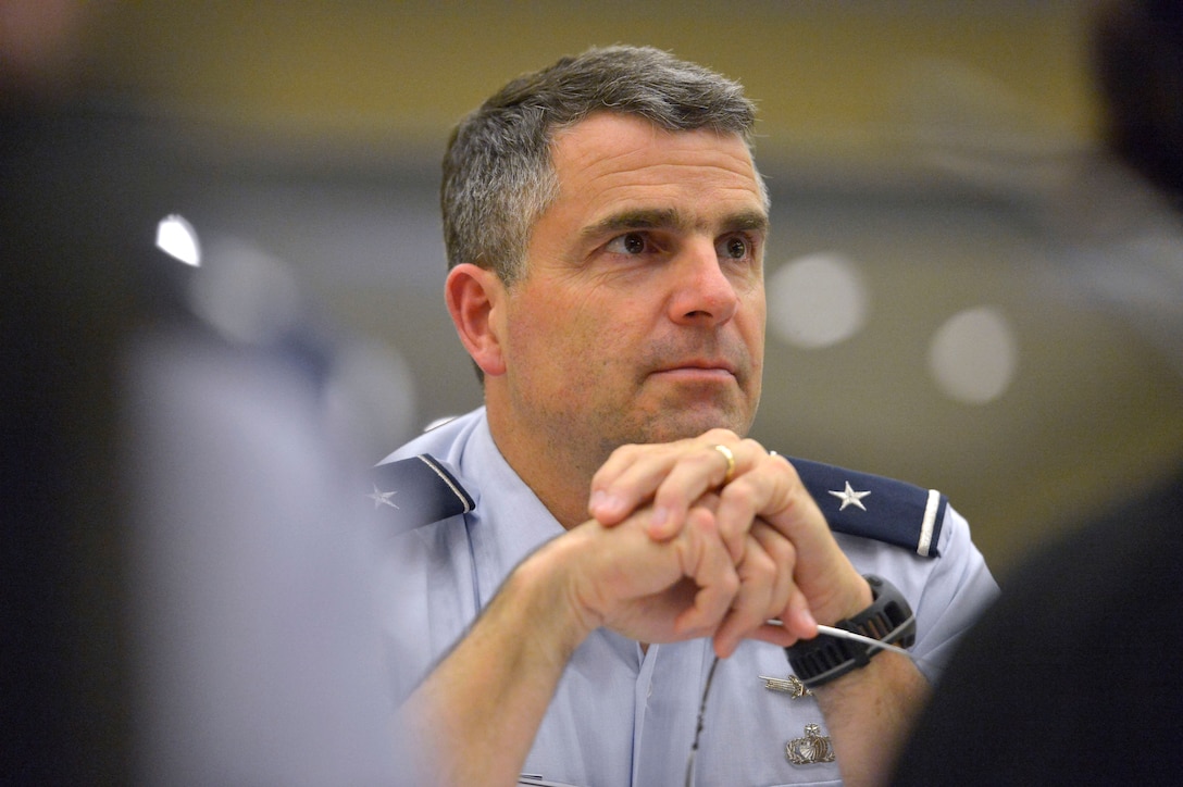 Air Force Brig. Gen. Bill Cooley listens as Deputy Defense Secretary Bob Work addresses participants of the U.S. Air Force's 2015 Senior Leader Orientation Course on Joint Base Andrews, Md., July 17, 2015. 