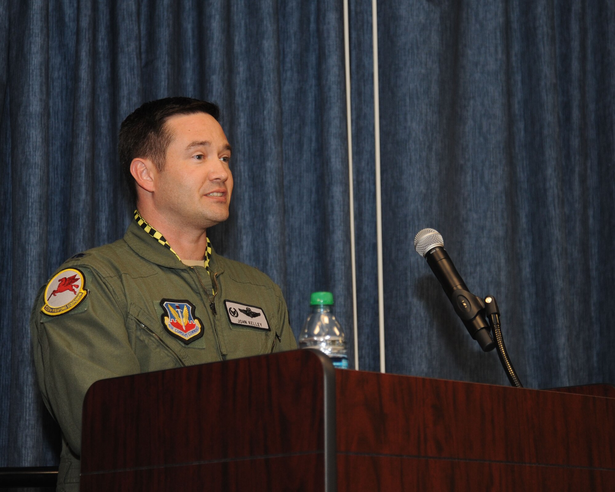 Lt. Col. John Kelley, 509th Weapons Squadron commander, explains his priorities and expectations over the next few years during the 509th WPS change of command ceremony July 17, 2015, at Fairchild Air Force Base, Wash. Kelley now leads the squadron after having served as its operations officer. He has deployed in support of Operations Enduring Freedom and Iraqi Freedom, and is a senior pilot with more than 3,500 flight hours. (U.S. Air Force photo/Senior Airman Sam Fogleman)