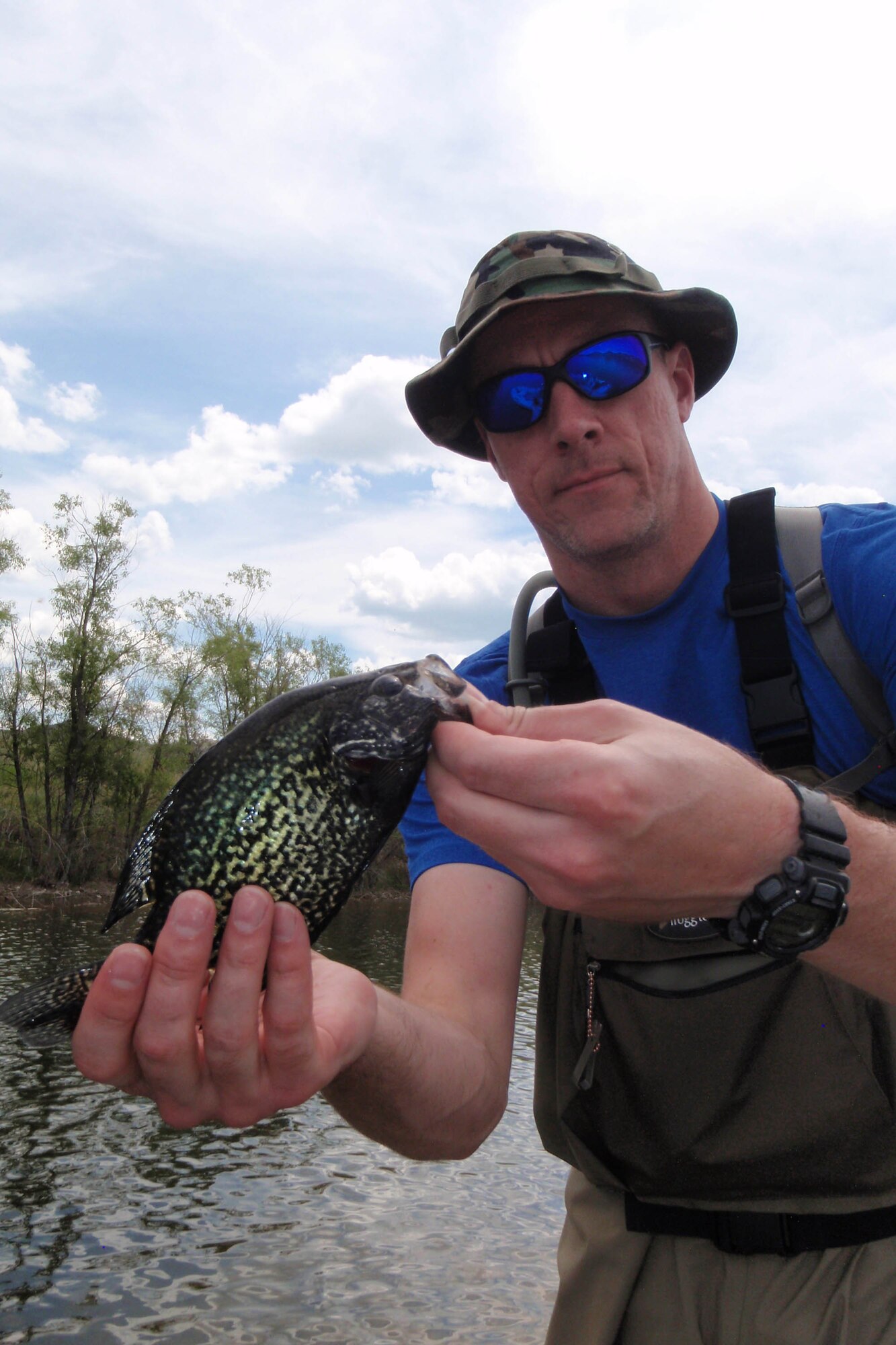 Tech. Sgt. Chad Thompson, 341st Missile Wing Public Affairs, shows off a black crappie he caught during a recent fishing outing to Pelican Point, June 7, 2015. Thompson has fallen in love with the outdoors since arriving to Montana and fly fishing is just one way he relieves his stress. (Courtesy photo)