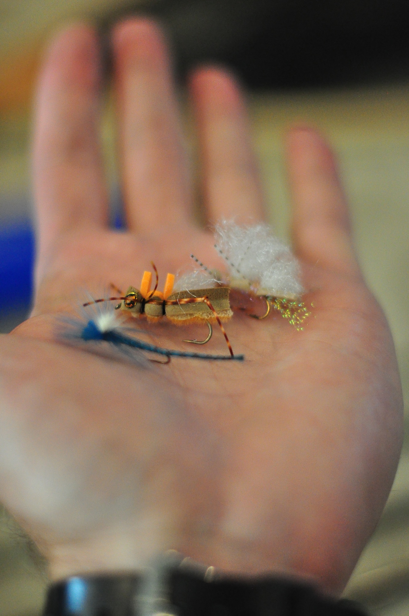 Tech. Sgt. Chad Thompson, 341st Missile Wing Public Affairs, displays a few of his favorite flies—a blue dragonfly and a couple types of grasshoppers. A bigger fly doesn’t always mean better when it comes to catching fish but these have proven to get some bites when nothing else in his box is working. (U.S. Air Force photo/Tech. Sgt. Chad Thompson)