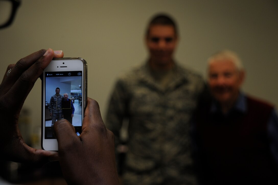 Retired Chief Master Sgt. of the Air Force, Robert Gaylor, poses for a photo with Senior Airman Andrew Tello 30th Comptroller Squadron lead defense travel administrator, like he did with many Airmen during his visit here, July 16, 2015, Vandenberg Air Force Base, Calif. Gaylor received a brief base tour of Vandenberg and spent most of his time engaging with Airmen during the many speaking engagements on his visit. (U.S. Air Force photo by Airman 1st Class Ian Dudley/Released)