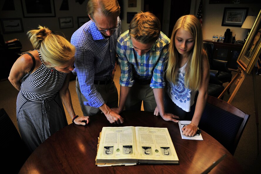 Descendants of U.S. Navy Lt. Seymour Johnson read about Johnson’s legacy during a base tour, July 15, 2015, at Seymour Johnson Air Force Base, North Carolina. After meeting the 4th Fighter Wing commander, the family toured the kennels for a military working dog demonstration, the air traffic control tower and the weapons load facility. (U.S. Air Force photo/ Senior Airman Daniel Blackwell)