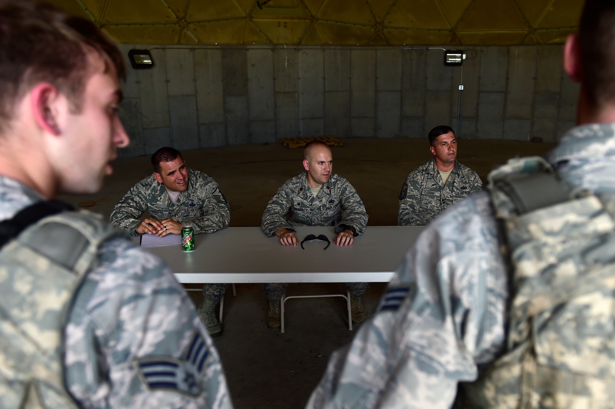 460th Security Forces Squadron Delta Flight members demonstrates their knowledge of Security Forces in front of a panel of experts during Flight of the Quarter competition July 16, 2015, on Buckley Air Force Base, Colo.  The competition is designed to test the Defenders’ expeditionary skills and build camaraderie within the flights. (U.S. Air Force photo by Staff Sgt. Stephany Richards/RELEASED)   