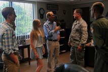 Descendants of U.S. Navy Lt. Seymour  Johnson meet with Col. Mark Slocum, 4th Fighter Wing commander, during a base tour, July 15, 2015, at Seymour Johnson Air Force Base, North Carolina. Slocum welcomed Johnson’s family to the installation and spoke with them about the base’s history. (U.S. Air Force photo/ Airman 1st Class Ashley Williamson)