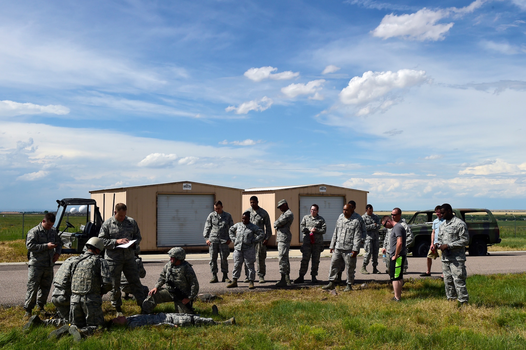 460th Security Forces Squadron Delta Flight members perform self-aid and buddy care during the Flight of the Quarter competition July 16, 2015, on Buckley Air Force Base, Colo.  The competition is designed to test the Defenders’ expeditionary skills and build camaraderie within the flights. (U.S. Air Force photo by Staff Sgt. Stephany Richards/RELEASED) 