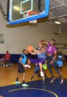 Tech Sgt. Patrick Green overcomes a blatant foul in the early portion of the second game of the season against the 336th Training Squadron July 15 at the Blake Fitness Center on Keesler Air Force Base.