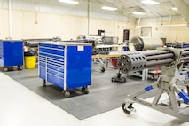 A 30mm GAU-8/A gatling gun rests in the 23d Equipment Maintenance Squadron armament flight shop July 17, 2015, at Moody Air Force Base, Ga. The armament flight is responsible for maintaining all of the A10C Thunderbolt II aircraft weapons systems components. (U.S. Air Force photo by Airman 1st Class Ceaira Tinsley/Released)