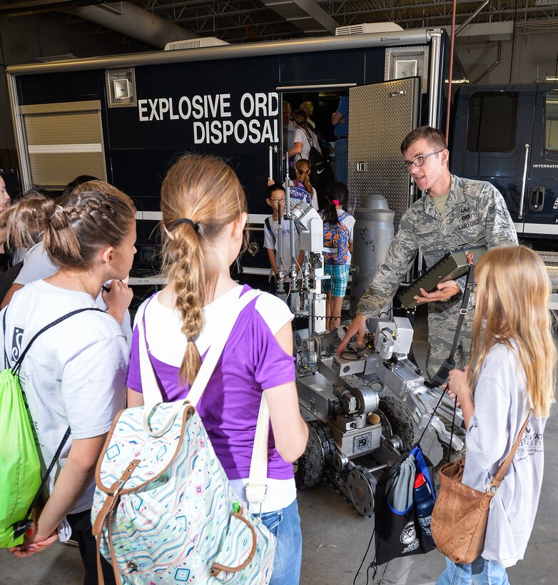 Airman 1st Class Jonathon Overbye, an explosive ordnance disposal technician assigned to the 775th Civil Engineer Squadron, answers WSU PREP students’ questions about a robot designed to interrogate potential explosive threats during a July 17 visit Hill Air Force Base, Utah. WSU PREP is a summer academic program offered by Weber State University to local 6th-grade students. The program is designed to motivate participants to seek education and careers in science, technology, engineering, and mathematics (STEM). Program participants were at Hill to witness firsthand how technology benefits their country. (U.S. Air Force photo/Ron Bradshaw)