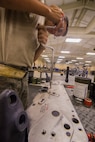 U.S. Air Force Senior Airman Adam Michaud, 23d Equipment Maintenance Squadron combat armament system team crew member, works on a A-10C Thunderbolt II bomb rack during dedicated weekend duty July 11, 2015, at Moody Air Force Base, Ga. Michaud is one of four armament flight Airmen who make up the dedicated weekend duty crew. (U.S. Air Force photo by Airman 1st Class Ceaira Tinsley/Released)