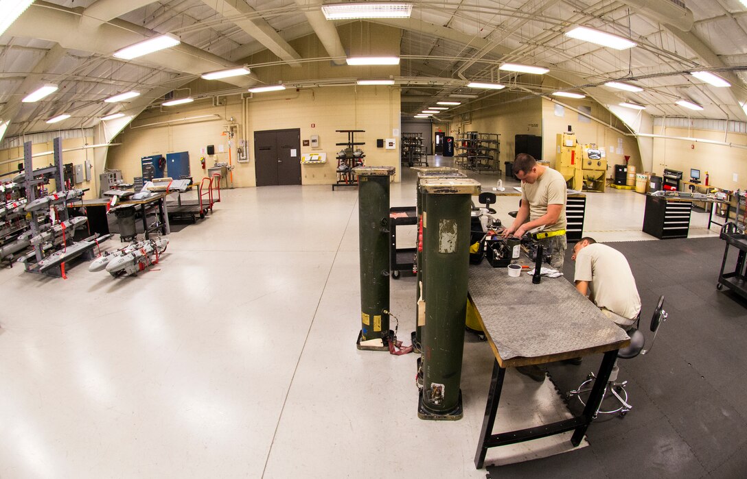 U.S. Air Force Staff Sgt. Chad Ufholz, 23d Equipment Maintenance Squadron weapons armament system craftsman, and Senior Airman Adam Michaud, 23d EMS combat armament system team crew member, assemble an A-10C Thunderbolt II bomb rack during dedicated weekend duty July 11, 2015, at Moody Air Force Base, Ga. The armament flight is responsible for maintaining all A-10C Thunderbolt II’s weapons systems components when they are removed from aircraft. (U.S. Air Force photo by Airman 1st Class Ceaira Tinsley/Released)