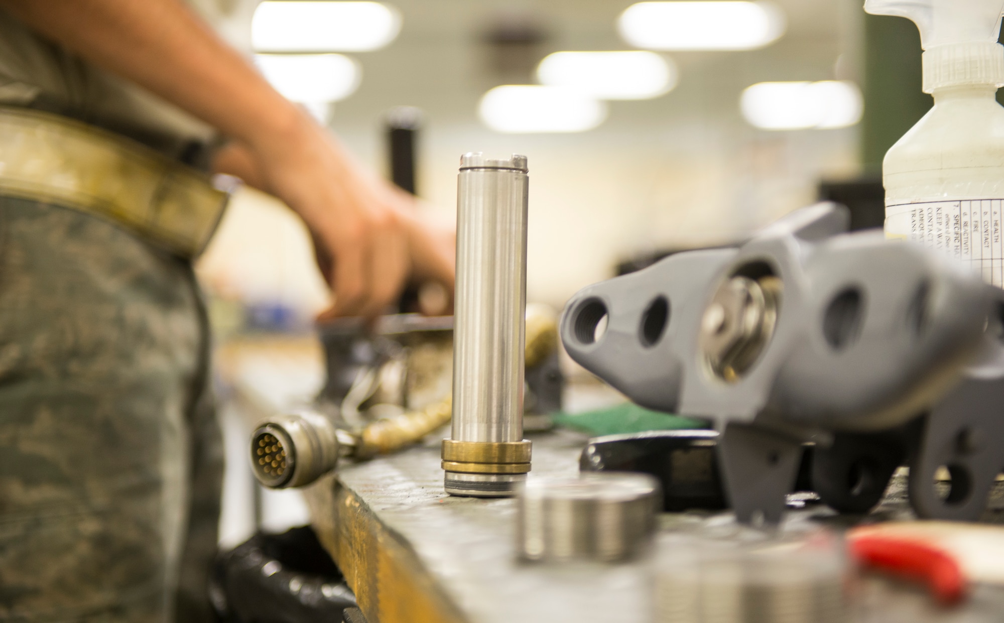 An ejector piston rests on the table before being installed into a bomb rack during the 23d Equipment Maintenance Squadron’s dedicated weekend duty July 11, 2015, at Moody Air Force Base, Ga. The 23d EMS’s dedicated weekend duty crew is designed to ensure A-10C Thunderbolt II phase inspections are complete on time while alleviating stress on Airmen. (U.S. Air Force photo by Airman 1st Class Ceaira Tinsley/Released)
