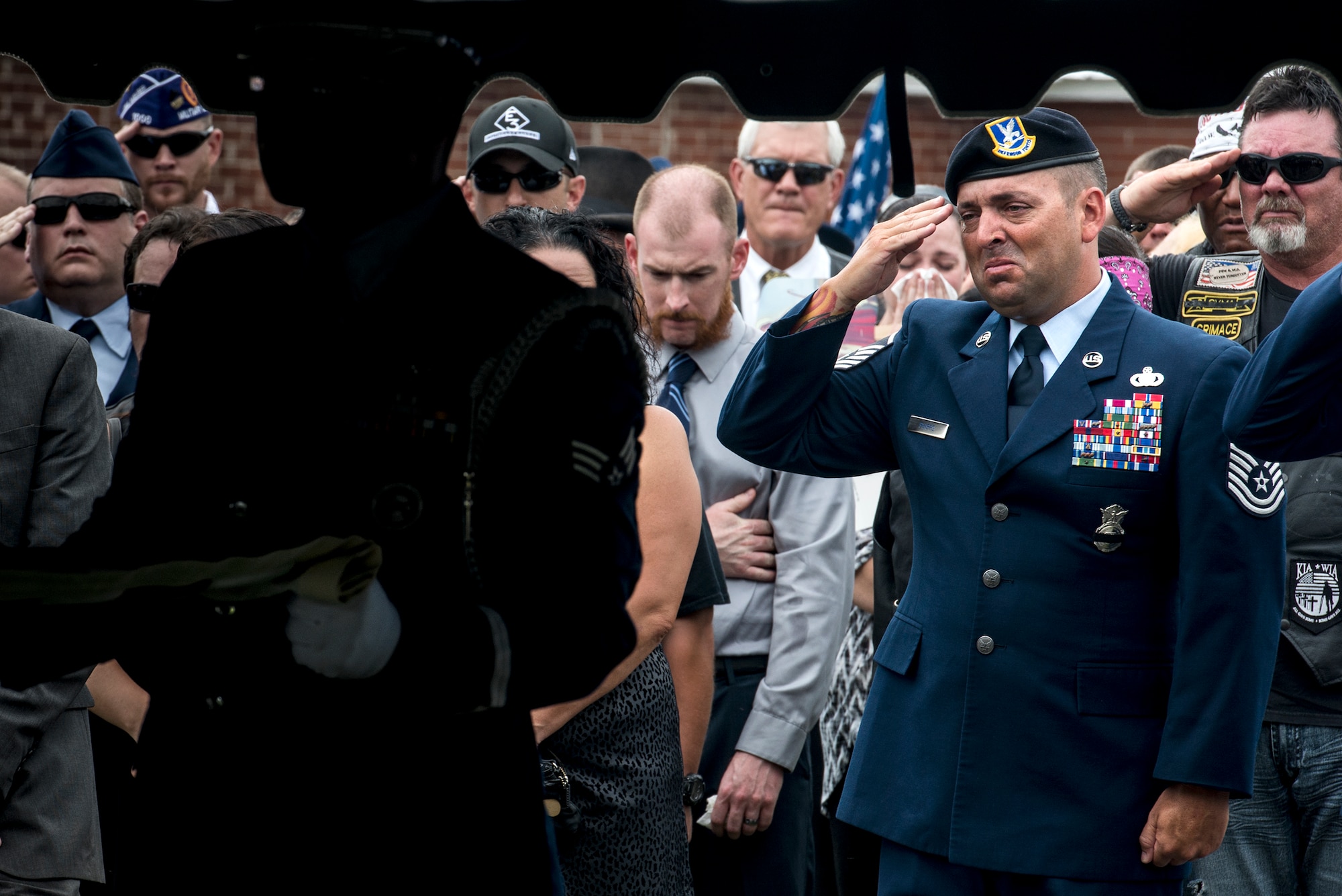 U.S. Air Force Master Sgt. Kelly Phipps, 820th Combat Operations Squadron, salutes a flag as it is folded in honor of deceased Tech. Sgt. Lee Fulp, July 14, 2015, at the Fellowship Baptist Church in Adel, Ga. Fulp, a Cook County, Ga. native, was stationed at Moody Air Force Base for four years. (U.S. Air Force photo by Senior Airman Ryan Callaghan/Released)
