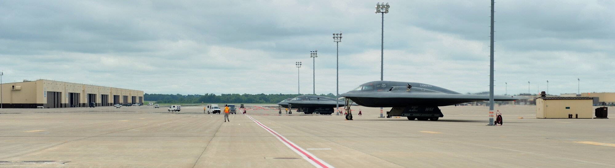Three B-2 Spirits prepare to taxi at Whiteman Air Force Base, Mo., July 10, 2015. Three dedicated crew chiefs were awarded with incentive flights for being named Crew Chiefs of the Year at the group and MAJCOM levels. (U.S. Air Force photo by Senior Airman Joel Pfiester/Released)
