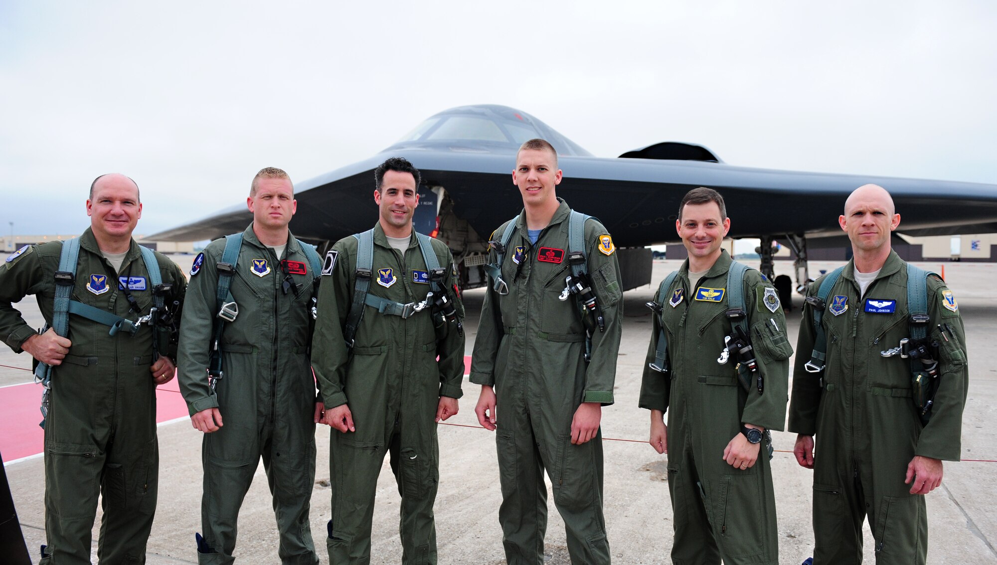 Pilots, as well as three Crew Chiefs of the Year, pose in front of a B-2 Spirit before receiving an incentive flight at Whiteman Air Force Base, Mo., July 10, 2015. The dedicated crew chiefs were awarded with the incentive flights for being named Crew Chiefs of the Year at the group and MAJCOM levels. (U.S. Air Force photo by Senior Airman Joel Pfiester /Released)