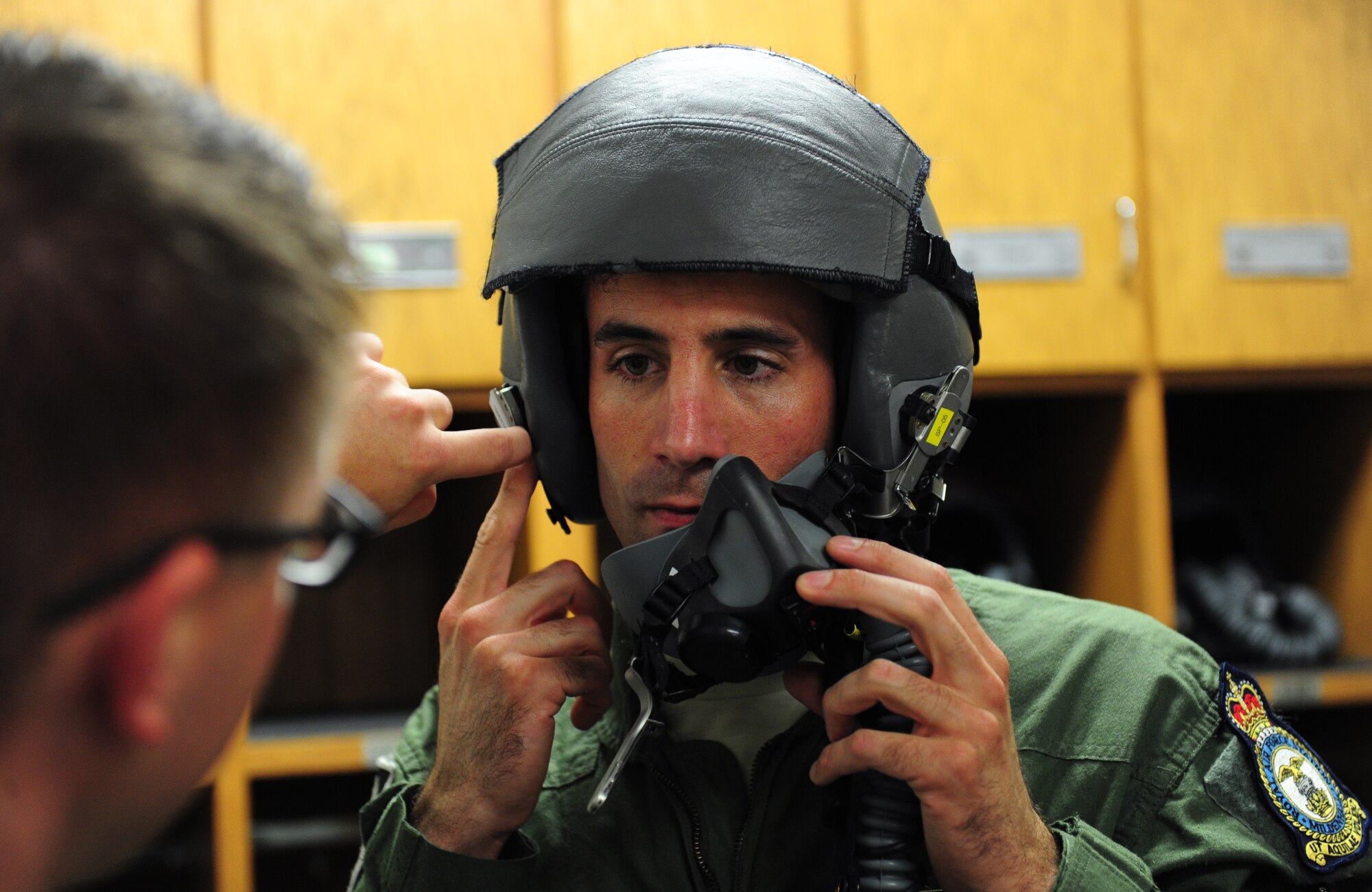 Tech. Sgt. Andrew Jones, 509th Aircraft Maintenance Squadron dedicated crew chief, gets his flight equipment checked before his incentive flight in a B-2 Spirit at Whiteman Air Force Base, Mo., July 10, 2015. Jones was awarded an incentive flight in the B-2 Spirit for being named the 2013 Air Force Global Strike Command Crew Chief of the Year. Two other Crew Chiefs of the Year were also given incentive flights the same day. (U.S. Air Force photo by Senior Airman Joel Pfiester/Released)