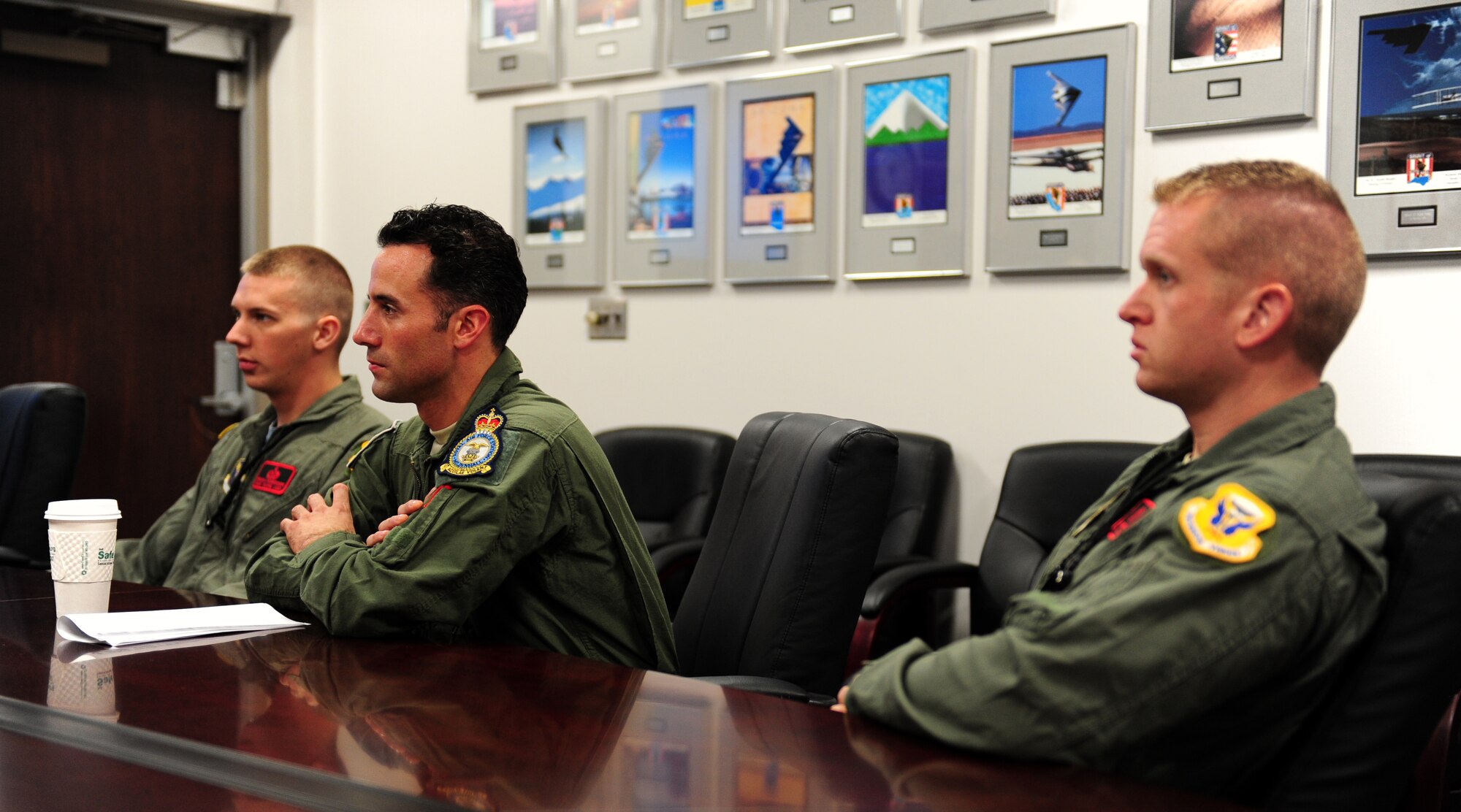 Air Force Staff Sgt. Brian Schroeder (left), Tech. Sgt. Andrew Jones (middle), and Air Force Staff Sgt. Joshua Thompson, 509th Aircraft Maintenance Squadron dedicated crew chiefs, sit in a mission briefing prior to being incentive riders on a B-2 Spirit at Whiteman Air Force Base, Mo., July 10, 2015. Only eight enlisted personnel have ever flown in a B-2 Spirit. (U.S. Air Force photo by Senior Airman Joel Pfiester/Released)