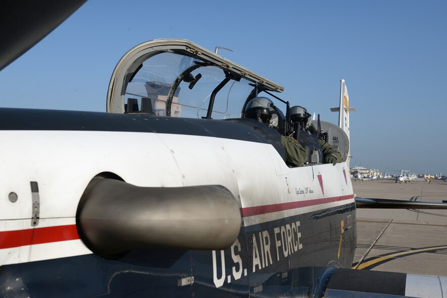 Capt. Robert Brown, front, T-6 Texan II instructor pilot, and 2nd Lt. Bryan Matz, 47th Student Squadron student pilot, conduct final pre-flight checks at Laughlin Air Force Base, Texas, July 14, 2015. Laughlin Air Force Base’s flying operation exceeds 80,000 flying hours and 51,000 sorties per year, giving Laughlin the sixth busiest airfield in the Air Force. (U.S. Air Force photo by Airman 1st Class Brandon May)

