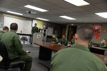 Specialized Undergraduate Pilot Training Class 16-09 conducts a formal briefing in the Coyote Flight classroom here, July 14, 2015.  During a formal briefing, the student pilots give the instructor an overview of the weather for the day, projected number of flights that will take place and how to perform the day’s chosen emergency procedure. (U.S. Air Force photo by Airman 1st Class Brandon May)
