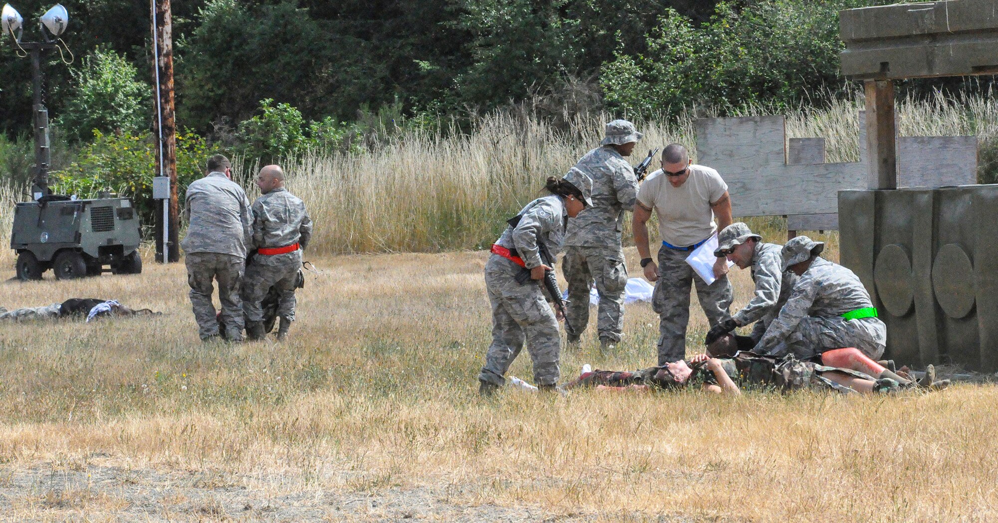 Reserve medics from the 446th ASTS simulate rescuing injured Airmen after a mock enemy attack as part of tactical combat casualty care training July 13 at the South 40, South Approach, here. Training for TCCC was a unique addition this year and part of a four-day field training mass casualty exercise, dubbed “Care Under Fire.”