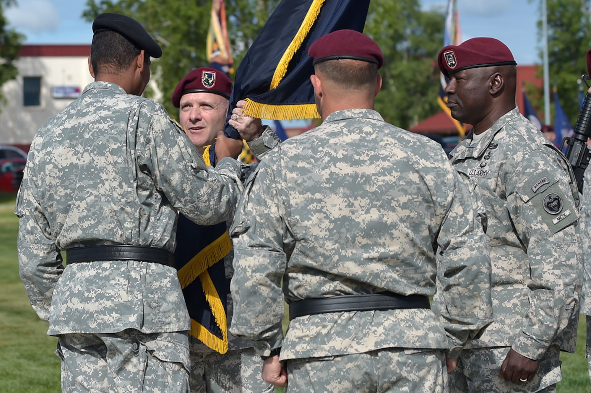 Maj. Gen. Bryan Owens takes the colors from Gen. Vincent Brooks. (U.S. Air Force photo/Justin Connaher)