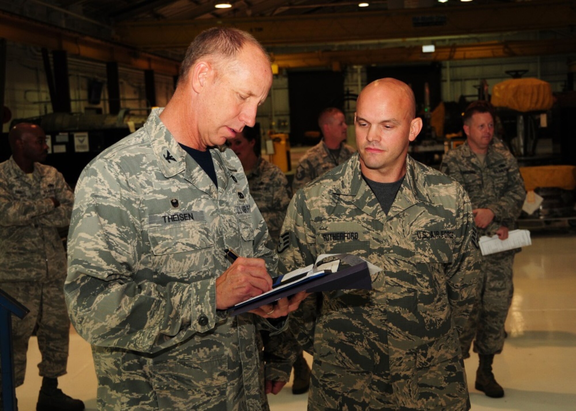 Col. Paul Theisen, 944th Mission Support Group commander, takes notes on information given by Staff Sgt. Aaron Rutherford, 916th Maintenance Squadron, July 10 during a tour of the 414th Fighter Group at Seymour Johnson, North Carolina. (U.S. Air Force photo taken by Tech. Sgt. Louis Vega Jr.)