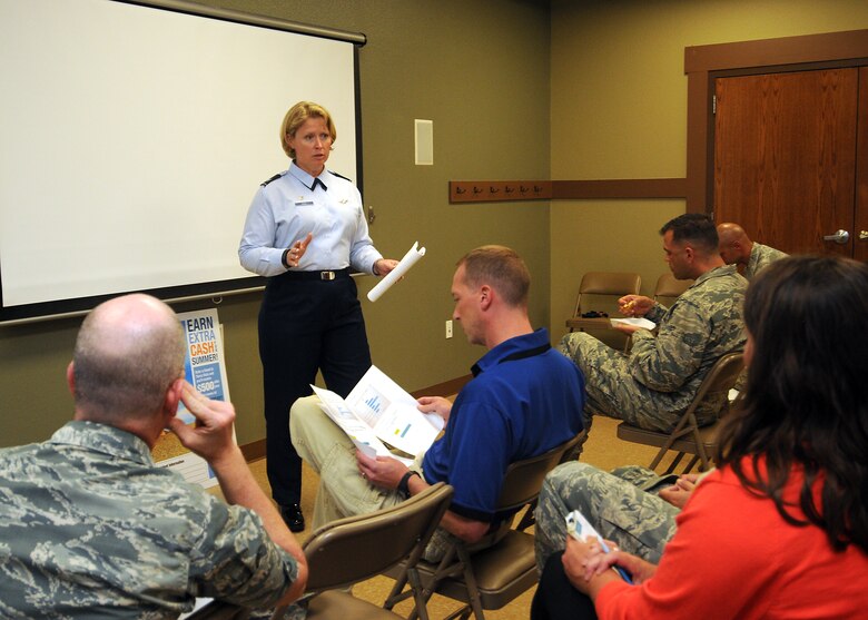 Col. DeAnna M. Burt, 50th Space Wing commander, speaks to residents of the Tierra Vista Community about local schools and transportation during a town hall Tuesday, July 14, 2015 at the TVC community center at Schriever Air Force Base, Colorado. The wing commander used this town hall to address concerns about transportation and schooling for the base’s children, and is planning to have the meetings regularly to address other topics relating to residents and living on base. (U.S. Air Force photo by Staff Sgt. Debbie Lockhart)