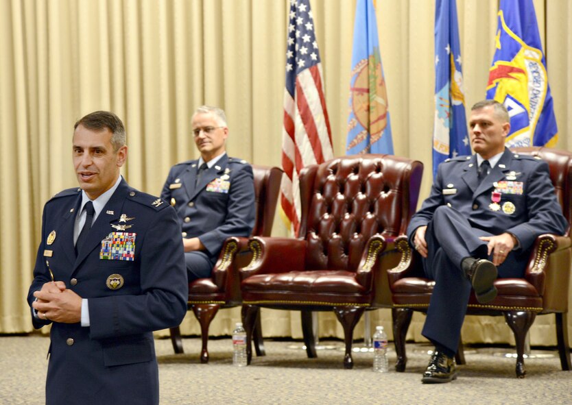 Col. Stan “Scott” Diamanti speaks to members of the 38th Cyberspace Engineering Installation Group after assuming command of the group July 9. Looking on are, from left, Col. Michael Harasimowicz, commander of the 688th Cyberspace Wing, Joint Base San Antonio-Lackland, Texas, who was the presiding officer for the ceremony, and former commander Col. Eric DeLange. (Air Force photo by Kelly White/Released)