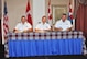 Lt. Col. Don Saunders, left, Brig. Gen. Alain Pelletier, center, and Lt. Col. Pete Dozois sign change of command orders July 10 at a Tinker Club ceremony in which Saunders became the new leader of the 552nd Air Control Wing Canadian Detachment. (Air Force photo by John Parker/Released)
