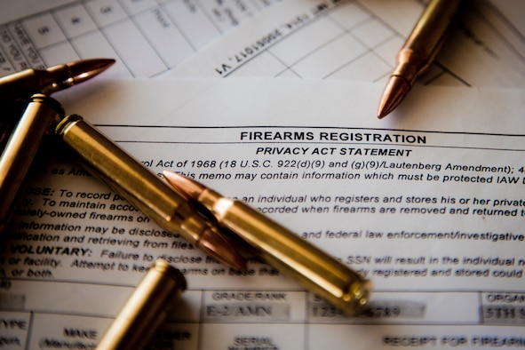 Six 5.56 cartridges sit on top of an AF Form 1314 Firearms Registration form and a DD Form 2760 Qualification to Possess Firearms or Ammunitions form at Minot Air Force Base, N.D., July 10, 2015. According to Staff Sgt. Justin McCoy, 5th Security Forces Squadron assistant NCO in charge of armory operations, if you reside in base housing, you are authorized by the installation commander to keep your personally owned weapons in your home, provided you register them with the 5th SFS Armory. (U.S. Air Force photo/Airman 1st Class Justin T. Armstrong)