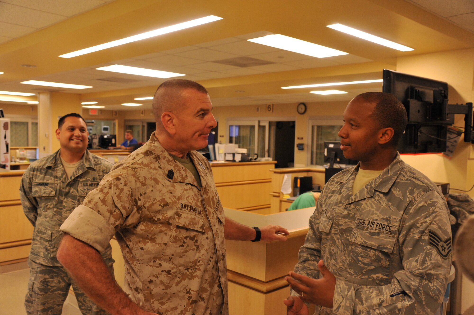 The nation's highest-ranking enlisted leader toured Wright-Patterson Air Force Base during a six-day trip to Ohio tohear the concerns and comments of service members, veterans and community leaders and send that message to the Pentagon.  Sgt. Maj. Bryan Battaglia speaks with Sgt. Kalen Mack (right) emergency room technician at the WPAFB Medical Center. (Air Force photo by Brian Brackens) 