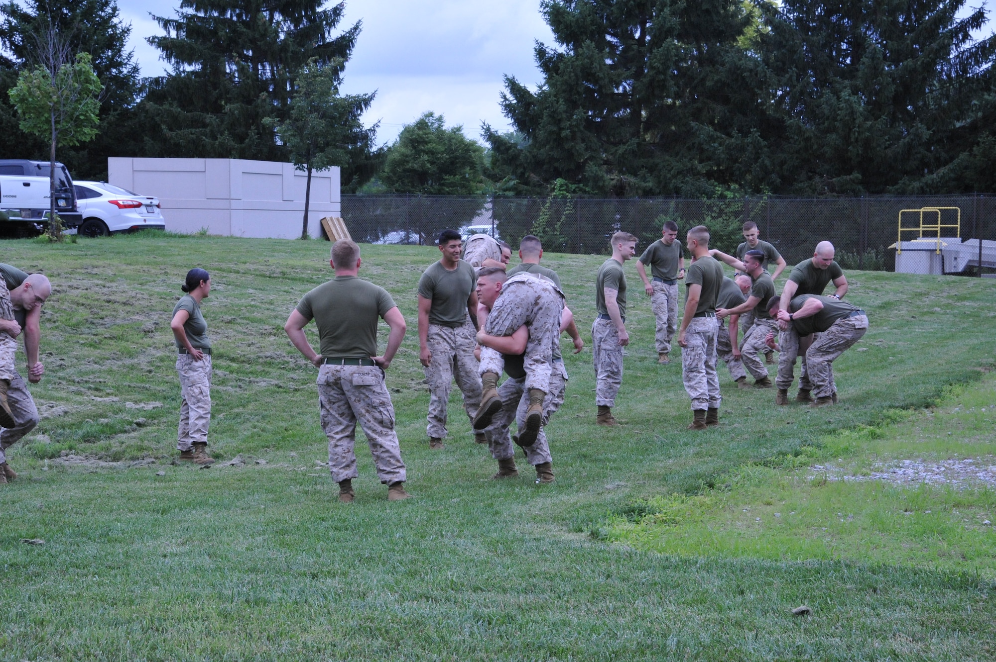 Marines from Military Police Company Charlie, 4th Law Enforcement Battalion at Wright-Patterson Air Force Base, participate in physical training, instructed by Lt. Sean Murello. (Air Force photo by Lauren Duke).