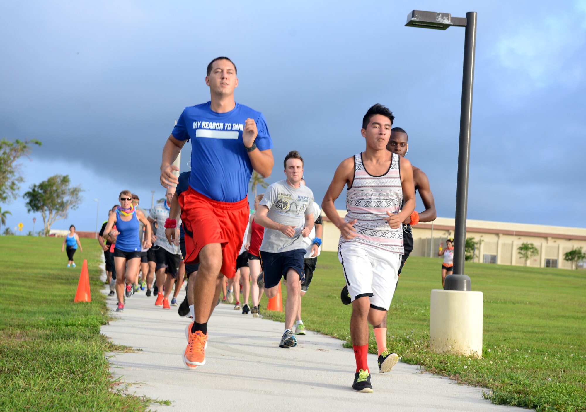 Runners take off for the Reggae 5K run July 16, 2015, at Andersen Air Force Base, Guam.  Approximately 80 participants competed in the reggae-themed 5K run organized by the 36th Force Support Squadron. (U.S. Air Force photo by Airman 1st Class Arielle Vasquez/Released) 