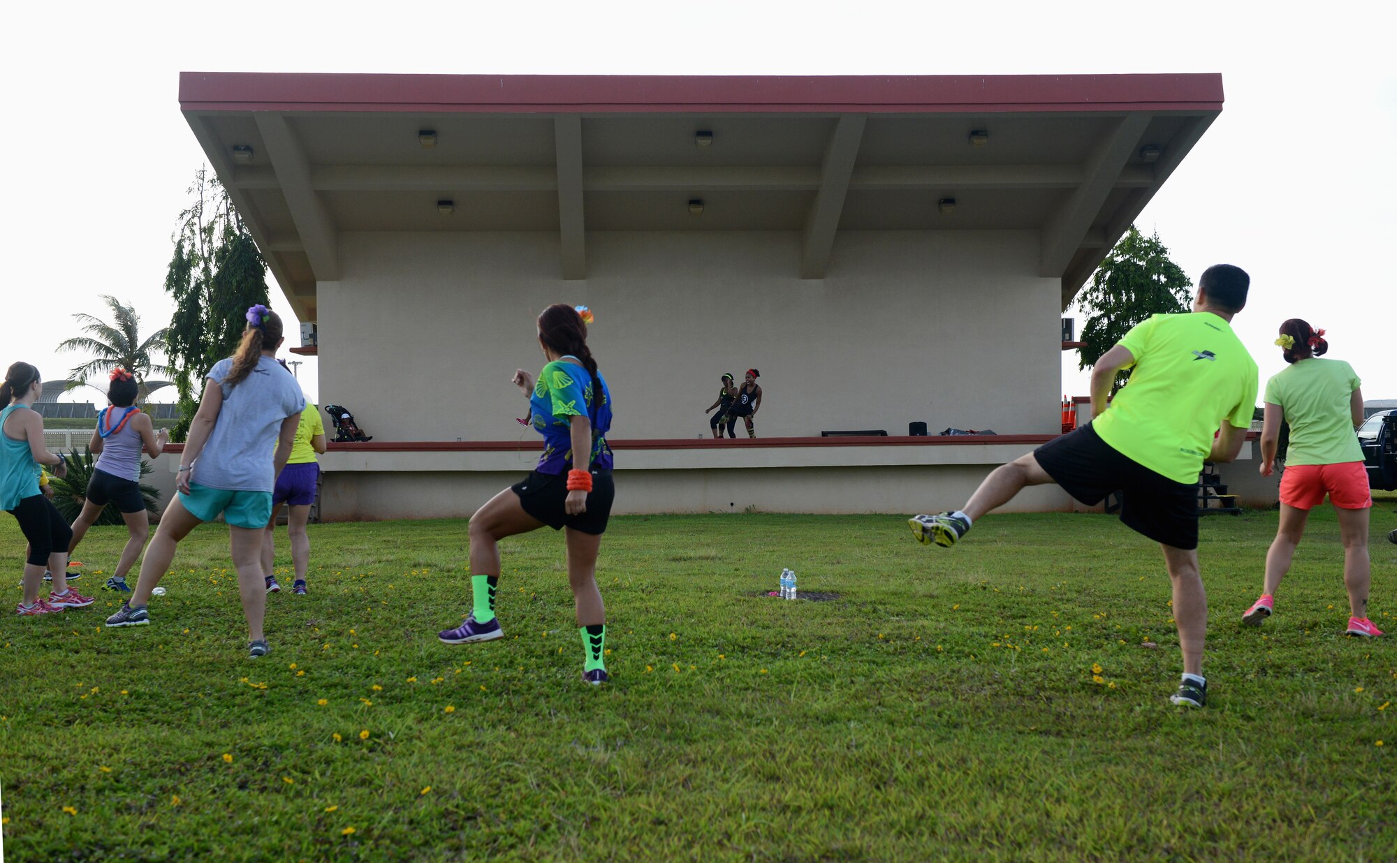 Runners participate in a warm-up before the Reggae 5K run July 16, 2015, at Andersen Air Force Base, Guam. Approximately 80 participants competed in the reggae-themed 5K run organized by the 36th Force Support Squadron. (U.S. Air Force photo by Airman 1st Class Arielle Vasquez/Released)