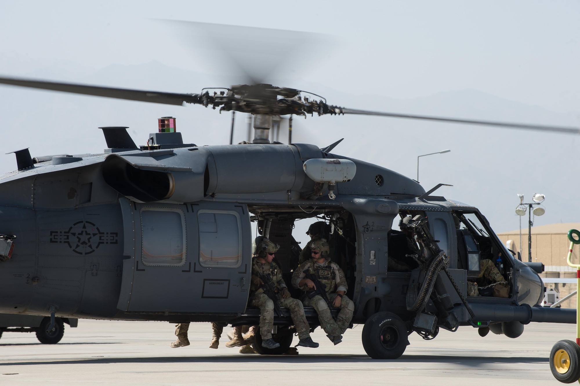 U.S. Air Force Guardian Angel team members assigned to the 83rd Expeditionary Rescue Squadron prepare to take off on a training mission July 16, 2015, at Bagram Airfield, Afghanistan. 83rd ERQS Guardian Angel’s mission is to rescue, recover, and return American or allied forces in times of danger or extreme duress.  (U.S. Air Force photo by Tech. Sgt. Joseph Swafford/Released)