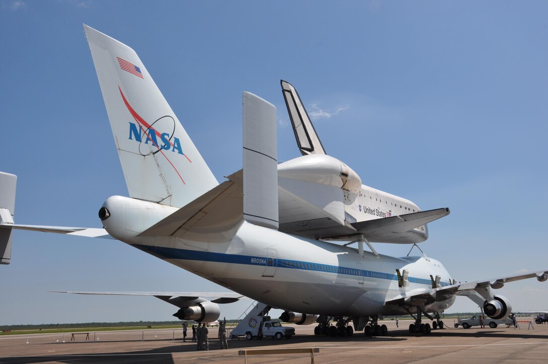 In this image released by the United States Army Reserve, the Space Shuttle Endeavour is shown in Houston, Texas, Wednesday, Sept. 19, 2012. The retired spacecraft made a brief stop at the city's Ellington International Airport before being flown to Los Angeles, where it will be permanently displayed at a museum complex there. The airport is adjacent to Ellington Field Joint Reserve Base, and troops from many of the units stationed there were on hand for the orbiter's arrival. (Photo/75th Training Command, Army Reserve Maj. Adam Collett) 
