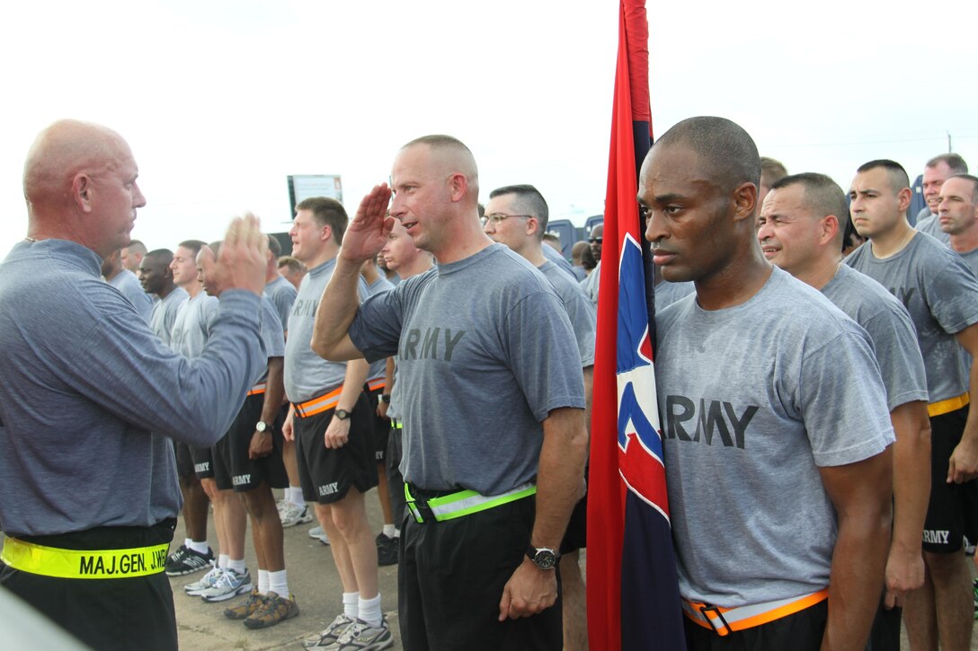 In this image released by the U.S. Army Reserve, soldiers with the 75th Training Command cool down after conducting a group formation run as part of a charity race in Houston, Saturday, Sept. 8, 2012. The race, dubbed the 9-11 Heroes Run, benefited the Travis Manion Foundation. The unit incorporated the event into its monthly training weekend in an effort to support the local community and to partner with public safety agencies. The 75th's commander, Maj. Gen. Jimmie Jaye Wells, addressed the troops after leading them in the run.