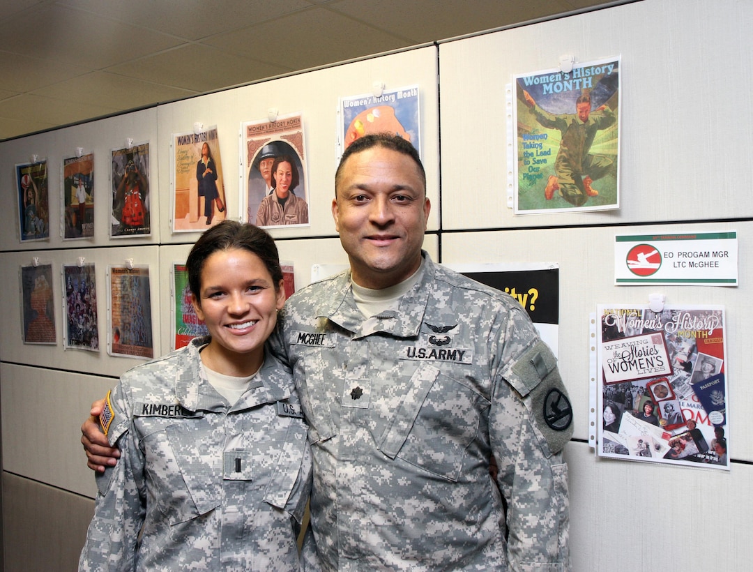 Lt. Col. Andreas J. McGhee, Equal Opportunity Program manager, Army Reserve 84th Training Command, Fort Knox, Ky., shares a moment with his daughter, 1st Lt. Andria Kimberly, an Army Reservist with the 801st Combat Support Hospital, Indianapolis, at the Command's Headquarters March 14, 2015. (U.S. Army Photo by Sgt. 1st Class Clinton Wood, 84th Training Command Public Affairs/Released)