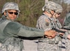 Lt. Col. Andreas J. McGhee, Equal Opportunity Program manager, Army Reserve 84th Training Command, Fort Knox, Ky., waits for the command to fire his M9 semi-automatic pistol during the Command Headquarters and Headquarters Company's range qualification day at Fort Knox, Ky., March 11, 2015. (U.S. Army Photo by Sgt. 1st Class Clinton Wood, 84th Training Command Public Affairs/Released)