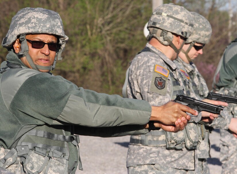 Lt. Col. Andreas J. McGhee, Equal Opportunity Program manager, Army Reserve 84th Training Command, Fort Knox, Ky., waits for the command to fire his M9 semi-automatic pistol during the Command Headquarters and Headquarters Company's range qualification day at Fort Knox, Ky., March 11, 2015. (U.S. Army Photo by Sgt. 1st Class Clinton Wood, 84th Training Command Public Affairs/Released)