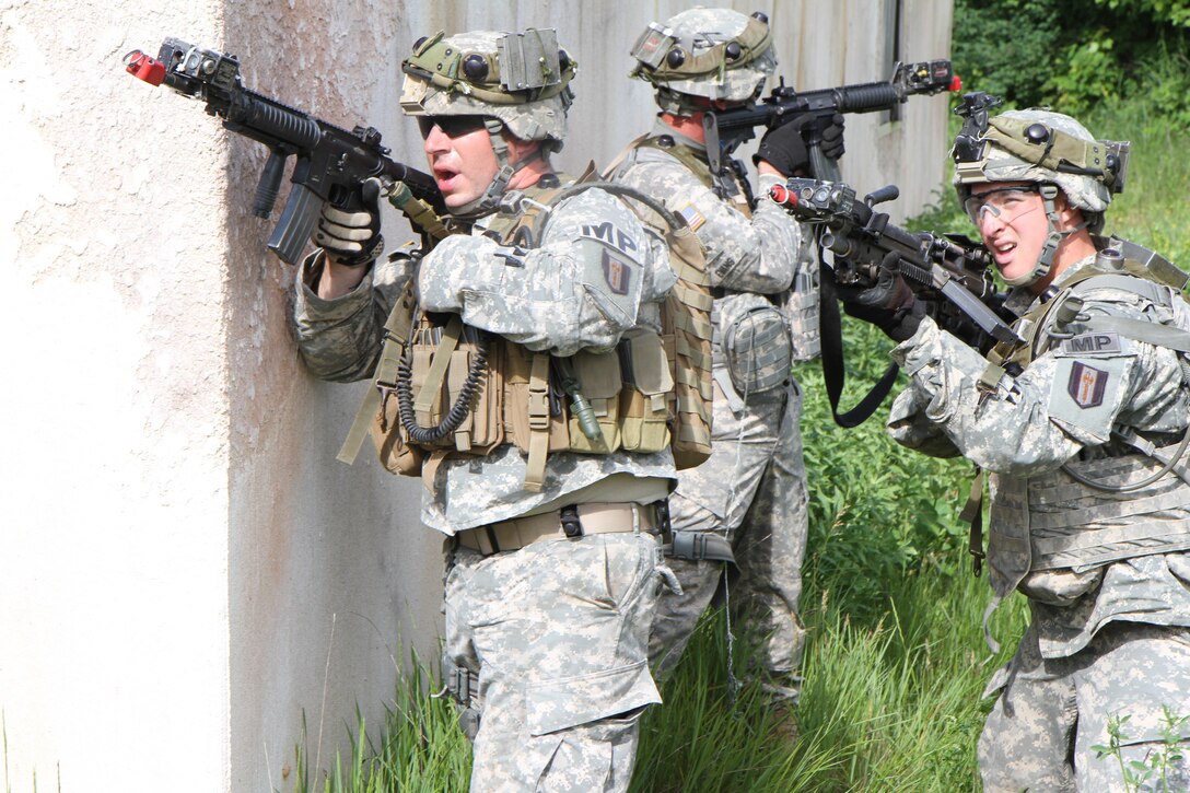 U.S. Army Soldiers assigned to the 94th Military Police Company, pull security during training at a Military Operation on Urbanized Terrain site at Fort McCoy, Wis., June 14, 2015. Soldiers of the 94th MP Company conducted training to improve unit readiness during Combat Support Training Exercise 78-15-02. The 78th Training Division’s Combat Support Training Exercise is a multi-component and joint endeavor which is integrated with Global Medic and QLLEX and occurring simultaneously at seven installations nationwide.