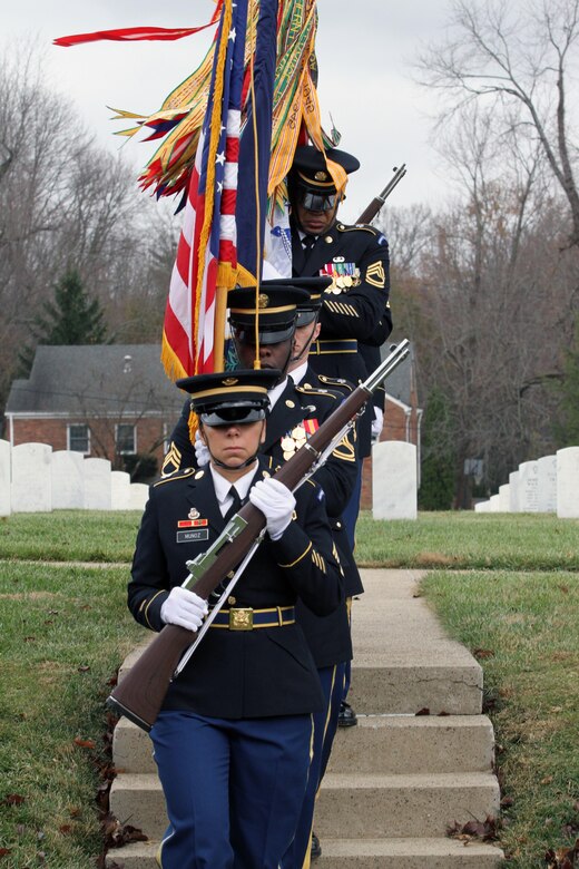Sgt. 1st Class Stacey A. Munoz, of Vine Grove, Ky., leads the Honor Guard from Human Resources Command, Fort Knox, Ky., during the Zachary Taylor National Cemetery wreath laying ceremony Monday, Nov. 24, 2014, in Louisville, Ky. (Photo by Clinton Wood, 84th TC Public Affairs)