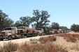 Vehicles driven by 432nd Transportation Company Soldiers are staged for offload after a two-week, 2,700-mile convoy operation from Fort Riley, Kan., to Fort Hunter Liggett, Calif., on July 17. The convoy operation was part of Nationwide Move 15, an annual Army Reserve approved functional training exercise designed to provide Reserve component transportation units with valuable, realistic training by conducting real-world operations in support of continental United States activities. (U.S. Army Photo by Sgt. Victor Ayala, 210th MPAD)