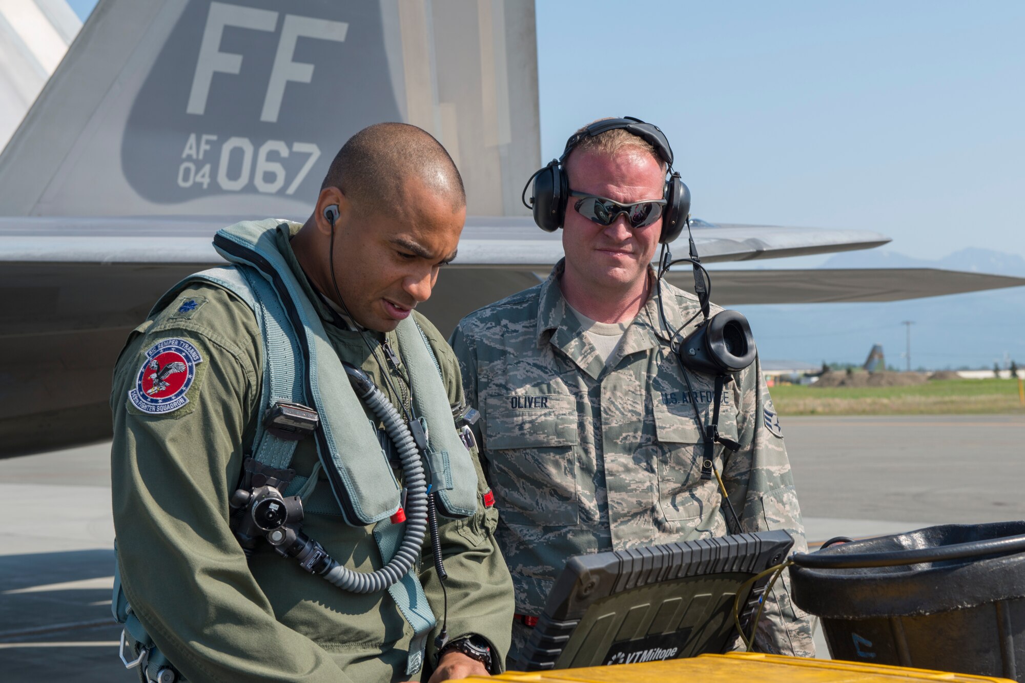 JOINT BASE ELMENDORF-RICHARDSON, Alaska –An F-22 pilot from the 149th Fighter Squadron, 192nd Fighter Wing, Virginia Air National Guard, reviews a pre-flight checklist with Senior Airman Greg Oliver, 94th Aircraft Maintenance Unit Crew Chief, 192nd Fighter Wing, Virginia Air National Guard, during Exercise Northern Edge 2015 at JBER, Alaska, June 15, 2015. NORTHERN EDGE is Alaska’s premier joint training exercises designed to perfect mission operations, techniques and procedures as well as enhance interoperability across all military branches, Reserves, and Air National Guard forces. (U.S. Air Force photo by Staff Sgt. Jonathan Garcia/Released)