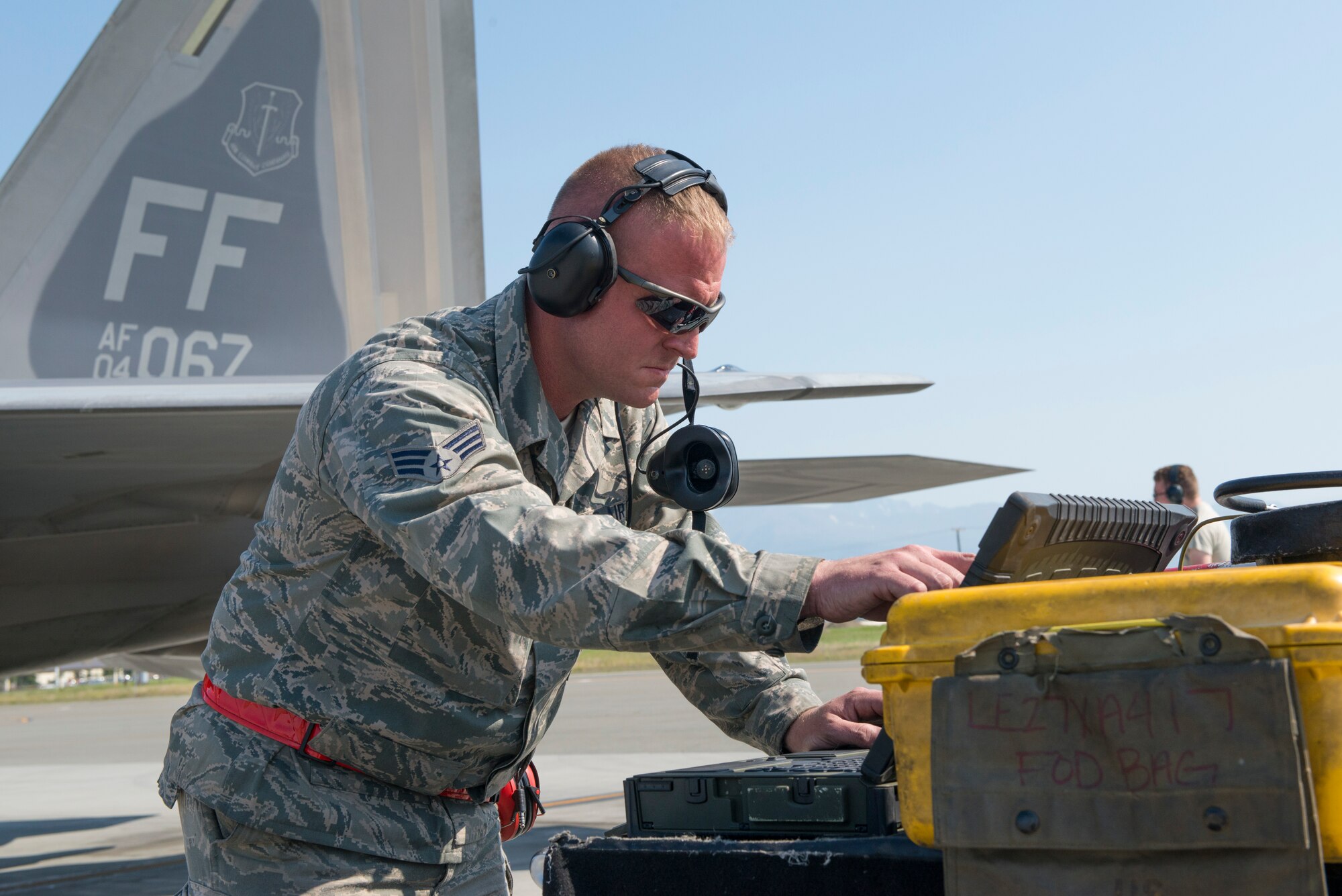 JOINT BASE ELMENDORF-RICHARDSON, Alaska – Senior Airman Greg Oliver, 94th Aircraft Maintenance Unit Crew Chief, 192nd Fighter Wing, Virginia Air National Guard, performs a pre-flight check during Exercise Northern Edge 2015 at JBER, Alaska, June 15, 2015. NORTHERN EDGE is Alaska’s premier joint training exercise designed to perfect mission operations, techniques and procedures as well as enhance interoperability across all military branches, Reserves, and Air National Guard forces. (U.S. Air Force photo by Staff Sgt. Jonathan Garcia/Released)